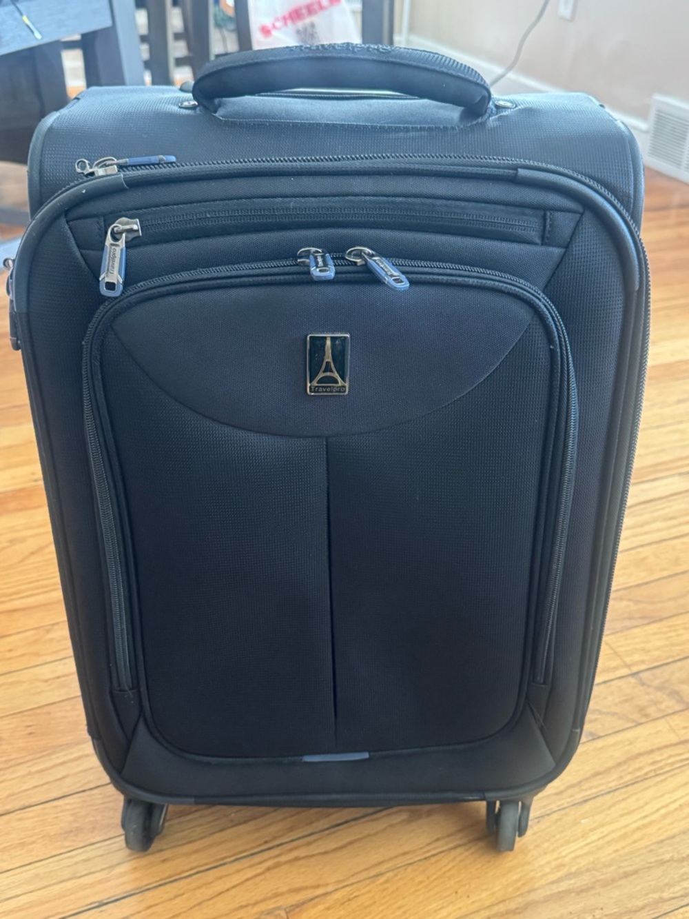 21 in. Travelpro Black Carry-On Spinner with Front Pocket by Travelpro